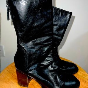(Unsure of brand) black heeled boots.